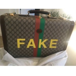 Gucci Not Fake Savoy Medium Suitcase with gold hardware.
